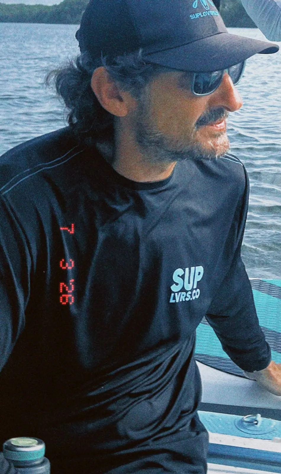 SUP lovers director on a paddle board in the swamp