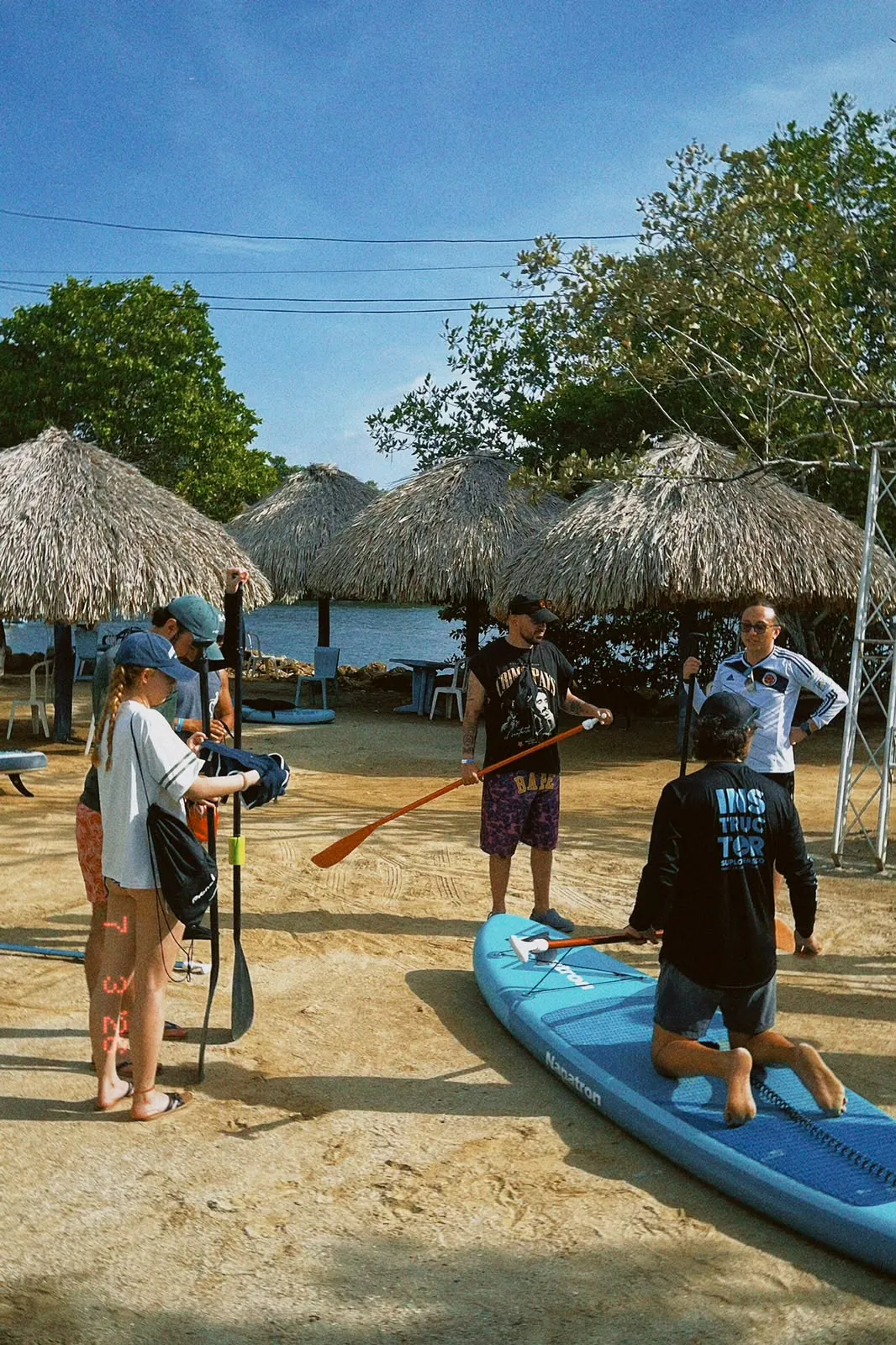 Instructor explaining balance on the paddle board