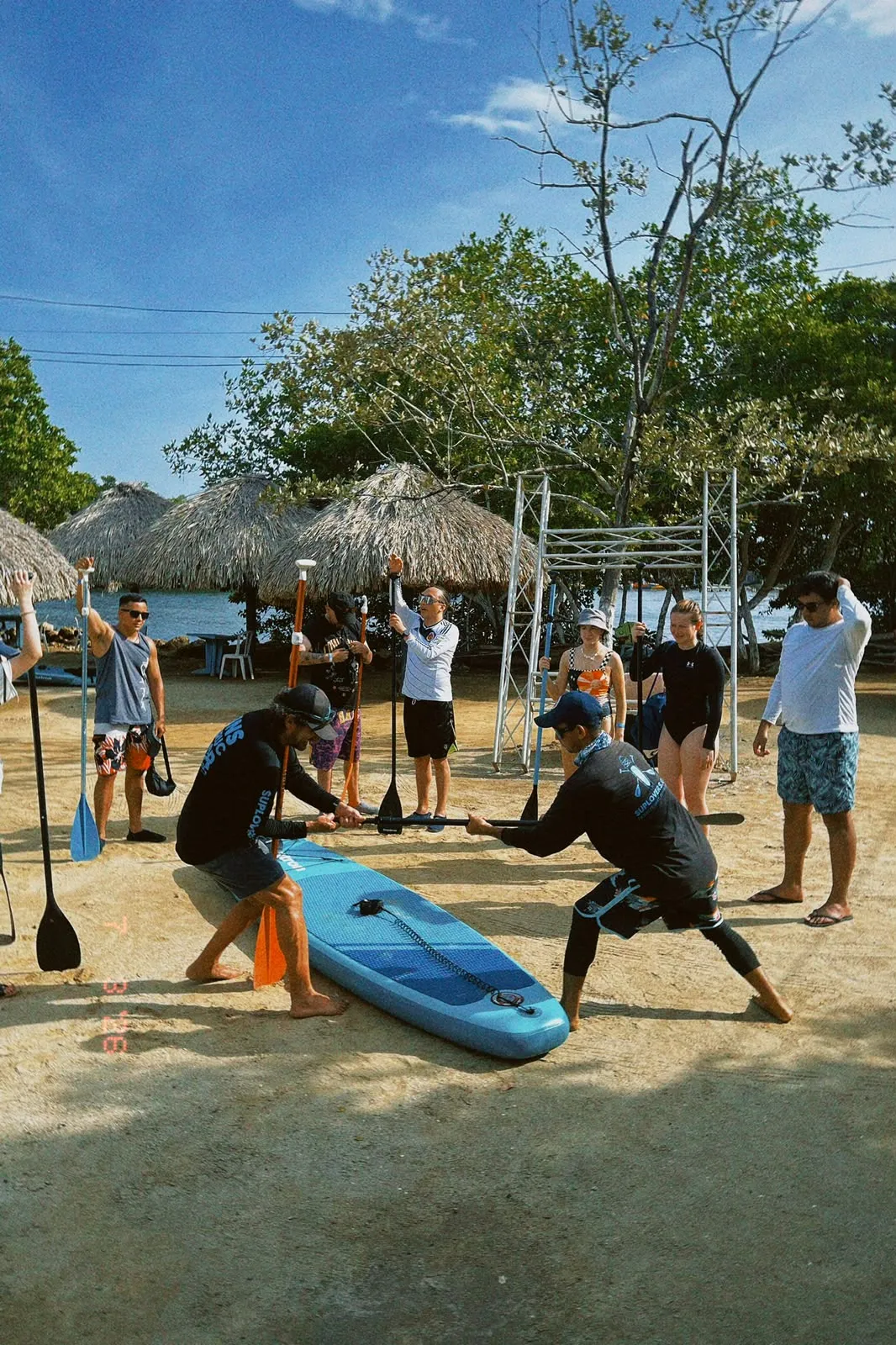 Instructors teaching the group the paddling technique