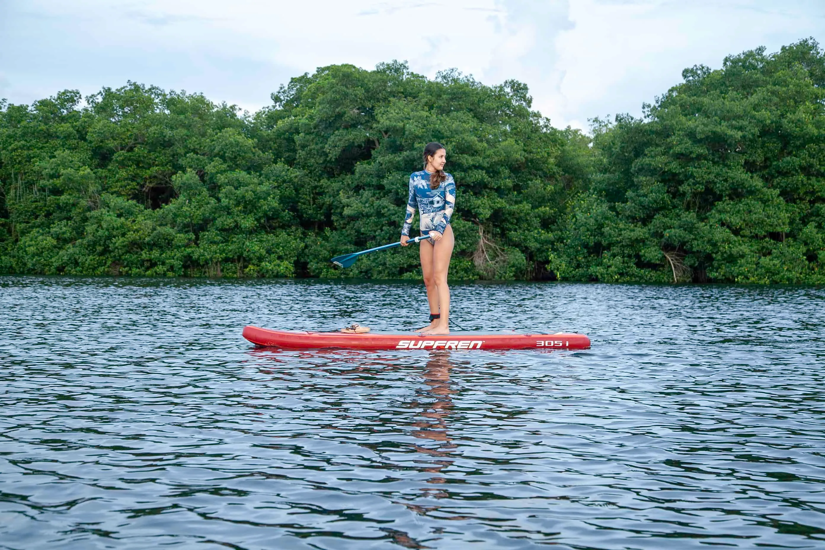 child learning paddleboard